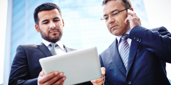 bigstock-Experienced-businessmen-discus-47775061